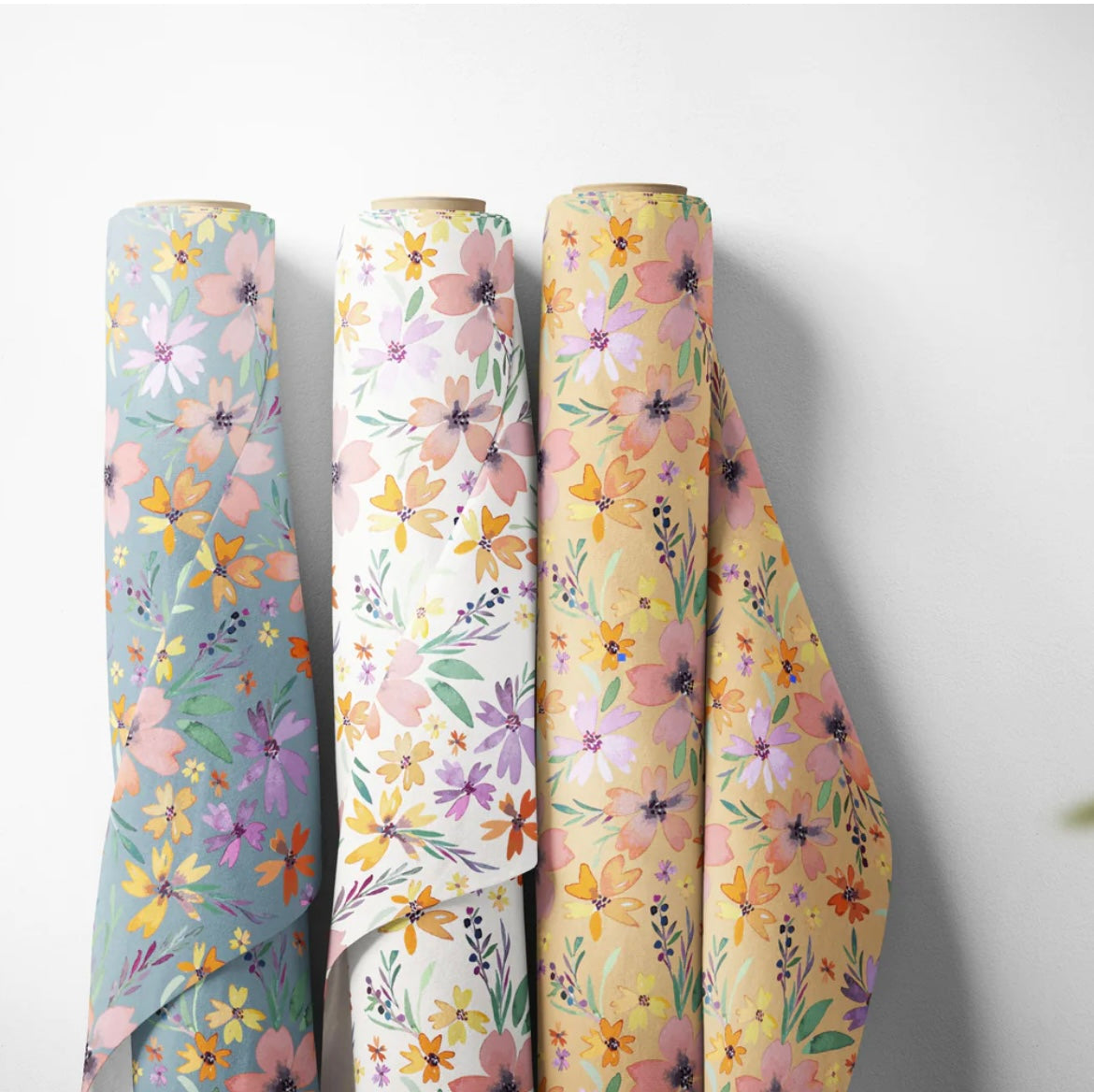 Rolls of watercolor floral fabric